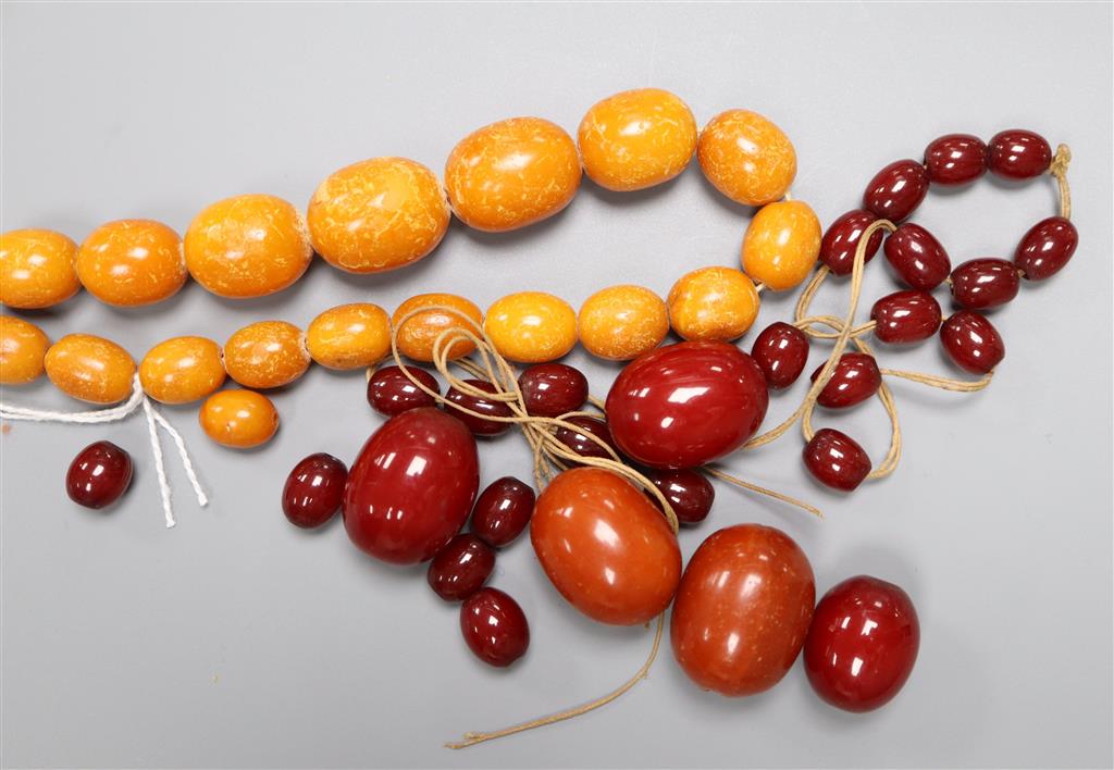 A single strand graduated amber bead necklace, 48cm, gross 40 grams, a large amber bead 10 grams and other loose beads